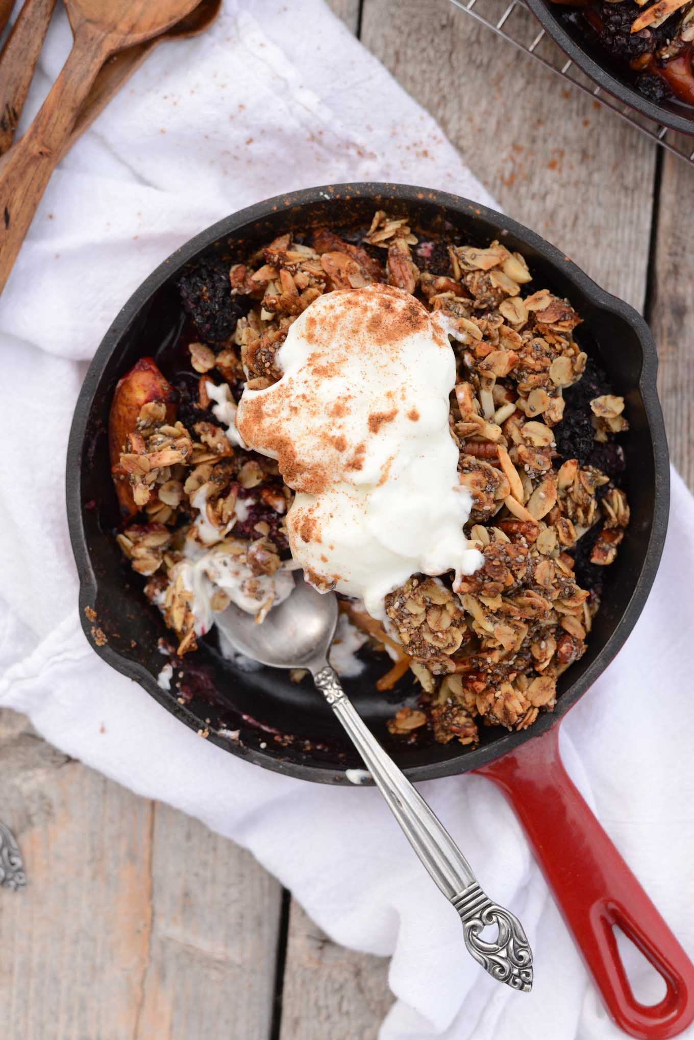 Fresh juicy nectarines with blackberries in this spiced skillet crisp for two. 