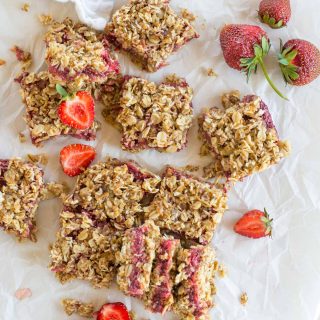 These 10 minute strawberry stuffed healthy oatmeal bars are the perfect on the go snack, even passing as a quick breakfast.